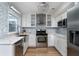 Stylish kitchen with white cabinetry, modern appliances, and a bright, efficient layout for cooking and dining at 1004 Natalie Se Ln, Smyrna, GA 30082
