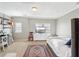 Bedroom with a light interior, multiple windows, a white bedspread, a desk, and shelving at 255 Southerland Ne Ter # 207, Atlanta, GA 30307