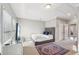 Bedroom with a plush rug, natural light, and a gray accent wall for a modern design at 255 Southerland Ne Ter # 207, Atlanta, GA 30307