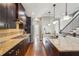 Elegant kitchen featuring a granite countertop, dark cabinets, and stainless steel appliances at 255 Southerland Ne Ter # 207, Atlanta, GA 30307