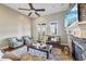 Inviting living room with stone fireplace, ceiling fan, and french doors to outdoor space at 255 Southerland Ne Ter # 207, Atlanta, GA 30307