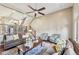 Cozy living room with a ceiling fan, access to the upper level, and comfortable seating at 255 Southerland Ne Ter # 207, Atlanta, GA 30307