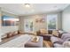 Spacious living room with large sectional sofa, TV, and bright windows at 255 Southerland Ne Ter # 207, Atlanta, GA 30307