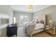 Bright main bedroom with large bed, balcony access, and stylish furnishings at 255 Southerland Ne Ter # 207, Atlanta, GA 30307