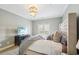 Comfortable main bedroom with a large bed, TV, and balcony access at 255 Southerland Ne Ter # 207, Atlanta, GA 30307