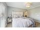 Serene main bedroom with tufted headboard, neutral colors, and soft lighting at 255 Southerland Ne Ter # 207, Atlanta, GA 30307