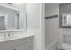 Bright bathroom featuring double sinks, white cabinets, and tiled floors for a clean, modern look at 86 De Arc Nw Pl, Atlanta, GA 30327