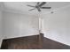 Spacious bedroom boasts rich hardwood floors and abundant natural light through a sizable window at 86 De Arc Nw Pl, Atlanta, GA 30327