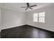 Elegant bedroom featuring hardwood floors and a large window, offering ample natural light and style at 86 De Arc Nw Pl, Atlanta, GA 30327