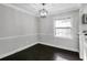Dining room with dark wood floors, a modern chandelier, and bright natural light at 86 De Arc Nw Pl, Atlanta, GA 30327