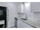 This kitchen has stainless steel appliances, white cabinets, and subway tile backsplash at 86 De Arc Nw Pl, Atlanta, GA 30327