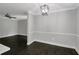 Spacious living room with dark wood flooring, crown moulding, and plenty of natural light at 86 De Arc Nw Pl, Atlanta, GA 30327