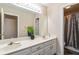 Bathroom featuring double sinks, vanity, and a shower with decorative curtain at 1647 Club Vista Trce, Stone Mountain, GA 30088