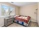 Bedroom featuring a nightstand, lamp, and large window at 1647 Club Vista Trce, Stone Mountain, GA 30088
