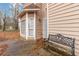 Exterior view of a home featuring a bay window, neutral siding, and a wrought iron bench at 1647 Club Vista Trce, Stone Mountain, GA 30088