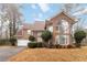 Beautiful two-story brick home with a well-manicured lawn and mature landscaping at 1647 Club Vista Trce, Stone Mountain, GA 30088