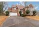 Beautiful two-story brick home with a well-manicured lawn and mature landscaping at 1647 Club Vista Trce, Stone Mountain, GA 30088