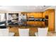Open kitchen featuring granite countertops, wooden cabinets, bar stool seating and stainless appliances at 1647 Club Vista Trce, Stone Mountain, GA 30088