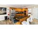 Spacious kitchen featuring stainless steel appliances, bar seating, and wooden cabinets at 1647 Club Vista Trce, Stone Mountain, GA 30088