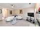 Cozy living room with fireplace, TV, and comfortable white sectional sofa at 1647 Club Vista Trce, Stone Mountain, GA 30088