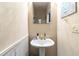 Cozy powder room featuring a pedestal sink and decorative elements at 1647 Club Vista Trce, Stone Mountain, GA 30088