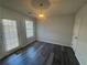 Cozy dining area with a sliding glass door to the exterior and modern lighting at 6120 Ruth St, Covington, GA 30014