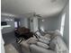 Bright living room with grey toned flooring, neutral walls, and plenty of space for furniture at 6120 Ruth St, Covington, GA 30014