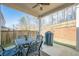 Covered patio with a dining set and grill that overlooks the backyard and an enclosing fence at 614 Denali Dr, Mableton, GA 30126