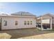 View of the backyard with a covered patio, perfect for outdoor dining and entertaining at 614 Denali Dr, Mableton, GA 30126