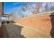 The backyard features a wooden fence, landscaping and green space at 614 Denali Dr, Mableton, GA 30126