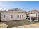 View of the backyard with a covered patio, grill, and fenced yard at 614 Denali Dr, Mableton, GA 30126