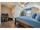 Cozy bedroom featuring hardwood floors, a comfortable bed, ceiling fan, and a window with blind coverings at 614 Denali Dr, Mableton, GA 30126