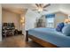Cozy bedroom featuring hardwood floors, a comfortable bed, ceiling fan, and a window with blind coverings at 614 Denali Dr, Mableton, GA 30126