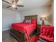 Cozy bedroom featuring a wood bed frame, hardwood floors, and a ceiling fan at 614 Denali Dr, Mableton, GA 30126
