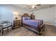 Comfortable bedroom featuring a decorative wood bed frame and hardwood flooring at 614 Denali Dr, Mableton, GA 30126