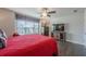 Well-lit bedroom with a large window, featuring a wood bed frame and TV at 614 Denali Dr, Mableton, GA 30126