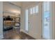 Bright foyer with hardwood floors, a windowed front door, and a view into the living area at 614 Denali Dr, Mableton, GA 30126
