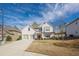Beautiful two-story home with a two-car garage, showcasing its well-maintained lawn at 614 Denali Dr, Mableton, GA 30126