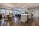 Open concept living room featuring hardwood floors, kitchen island, and lots of natural light at 614 Denali Dr, Mableton, GA 30126