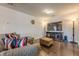 Spacious living room features hardwood floors, large TV and comfortable seating arrangement at 614 Denali Dr, Mableton, GA 30126