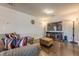 Spacious living room features hardwood floors, large TV and comfortable seating arrangement at 614 Denali Dr, Mableton, GA 30126