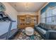 Living room with hardwood floors, crystal chandelier, and a built-in wooden cabinet for decor at 614 Denali Dr, Mableton, GA 30126