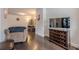 Comfortable living room with hardwood floors, a mounted television and a dark wood dresser at 614 Denali Dr, Mableton, GA 30126