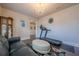 Living room with hardwood floors, crystal chandelier, and a built-in wooden cabinet for decor at 614 Denali Dr, Mableton, GA 30126