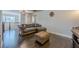 Open-concept upstairs living room with hardwood floors and comfortable seating area at 614 Denali Dr, Mableton, GA 30126