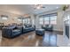 Cozy living room featuring a fireplace, hardwood floors, and lots of natural light at 614 Denali Dr, Mableton, GA 30126