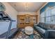 Living room with hardwood floors, crystal chandelier, and a built-in wooden cabinet for decor at 614 Denali Dr, Mableton, GA 30126