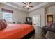 A spacious main bedroom boasts a television, and an adjoined bathroom featuring a soaking tub and tile flooring at 614 Denali Dr, Mableton, GA 30126