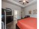 Main bedroom featuring hardwood floors, an exercise bike, an en suite bathroom, and a ceiling fan at 614 Denali Dr, Mableton, GA 30126