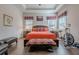 Spacious main bedroom featuring hardwood floors, ceiling fan, and a stationary bike at 614 Denali Dr, Mableton, GA 30126